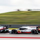A Porsche LMP1 passing one of the Porsche GTE Pro cars.